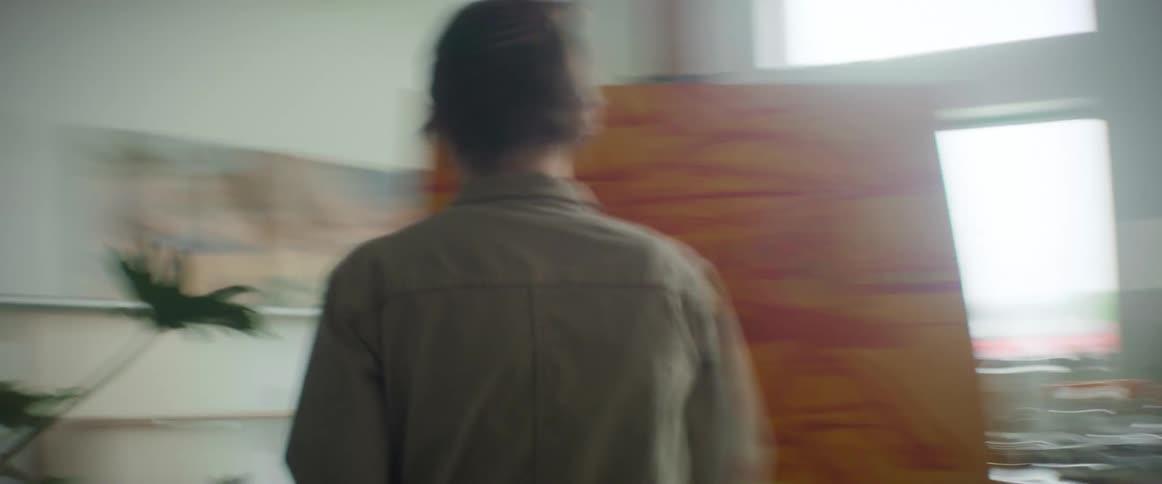 Orbiting time lapse of an artist painting