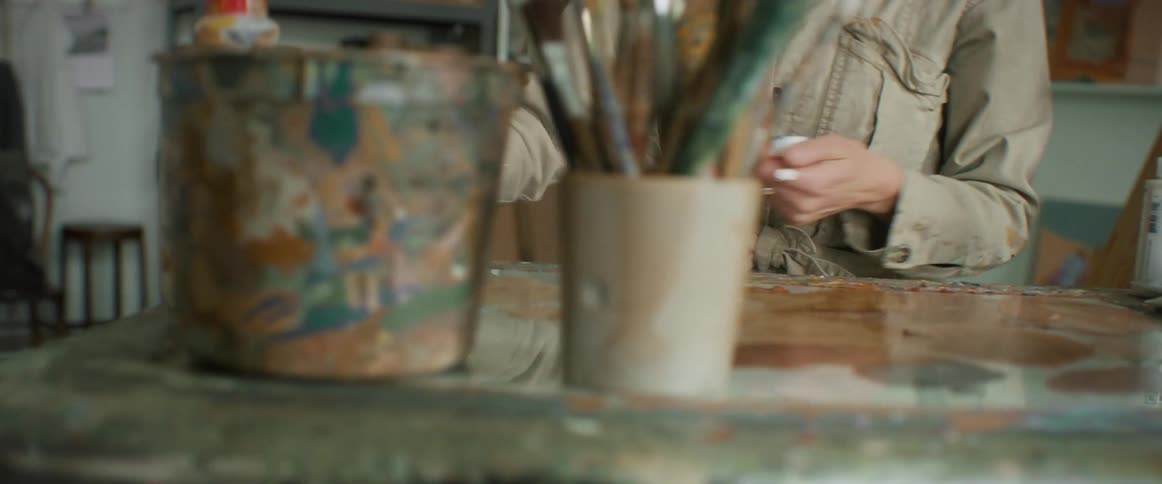 Artist painting in her studio