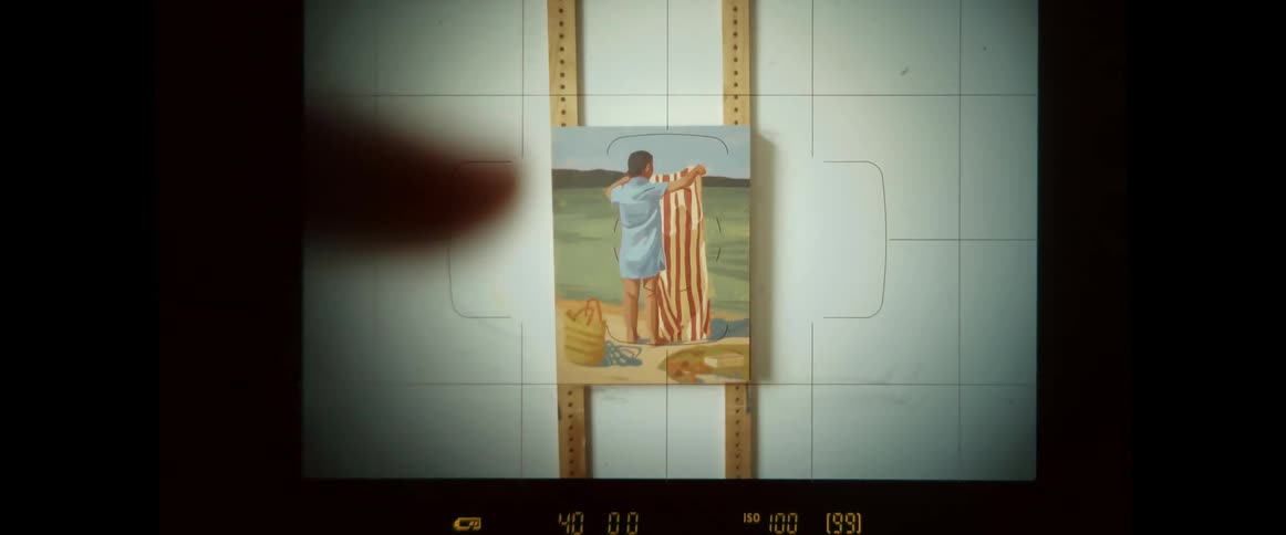 Taking pictures of a painting in the wall