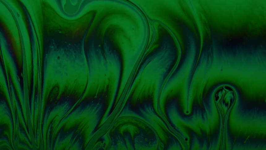 Abstract green and psychedelic fluid in slow motion
