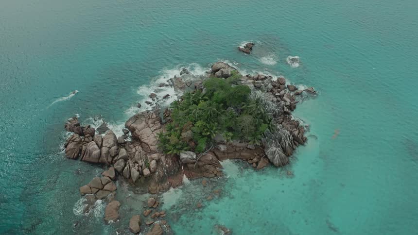 Aerial panorama of an island surrounded by turquoise blue sea