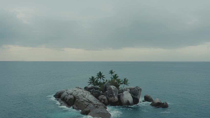 Aerial panorama of a small island on a cloudy day