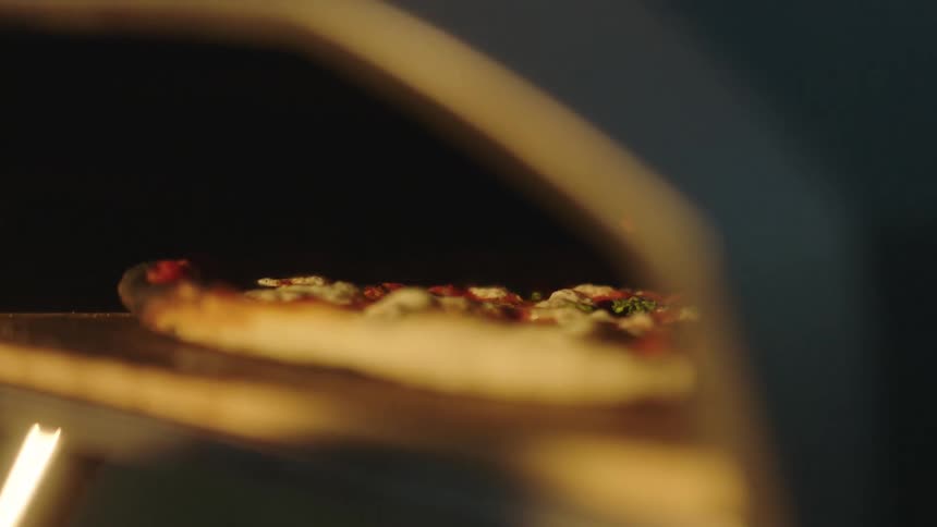 Pizza cooking inside an oven at home