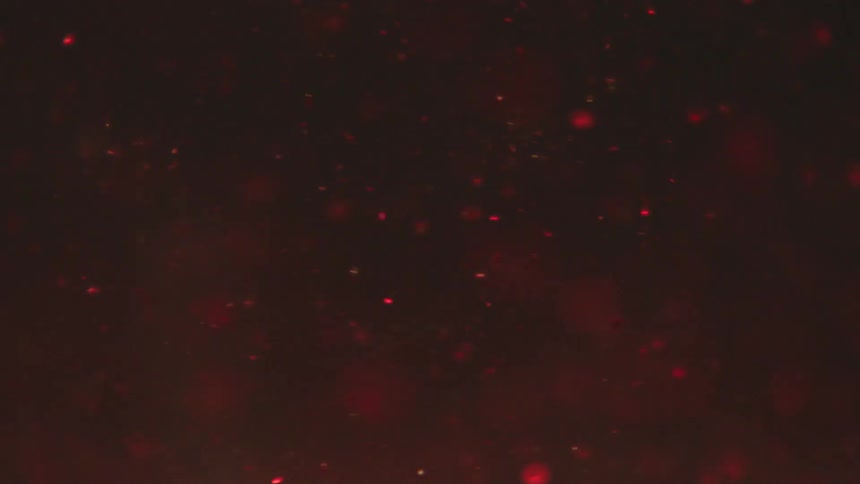 Several red particles flying to the left