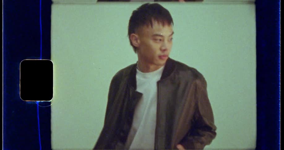 Young man modeling clothes caught on vintage film