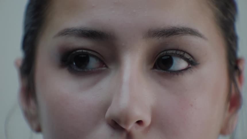 Closeup of a young womans face with eye makeup