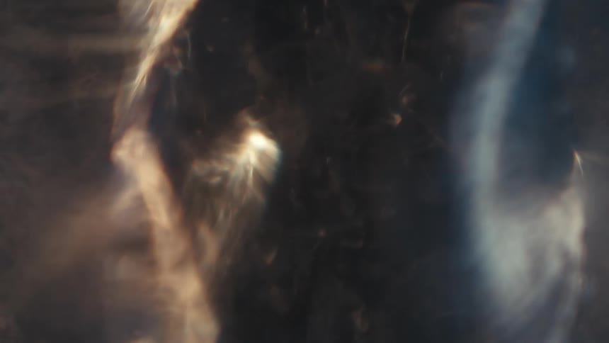 Extreme closeup of a spiral in the water in slow motion