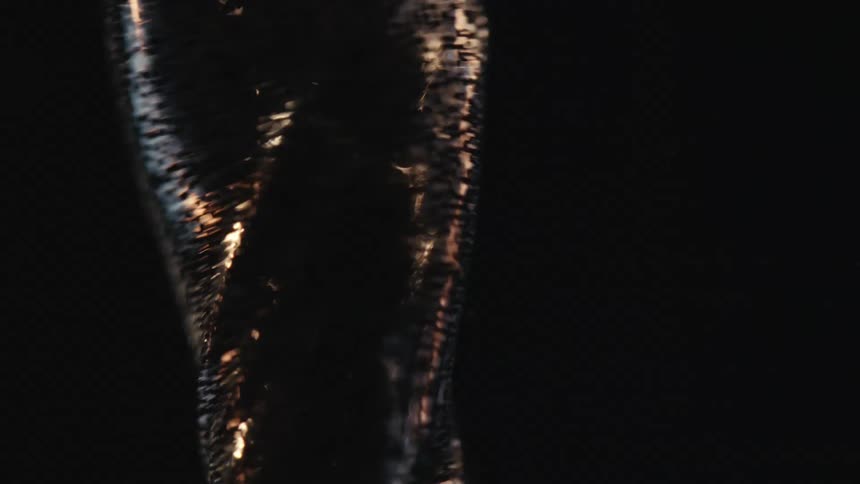 Extreme closeup of water spiraling and increasing speed in slow motion