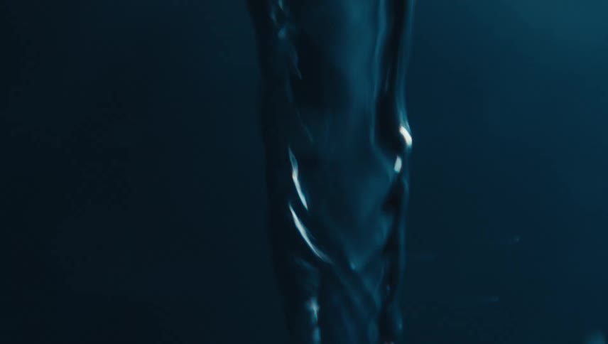 Close up of swirling clear water against a black background