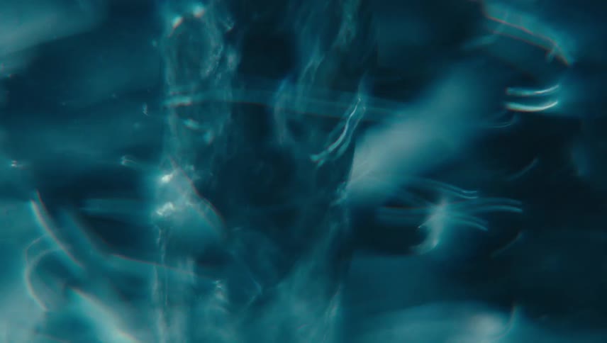 Close up of swirling clear water against a black background