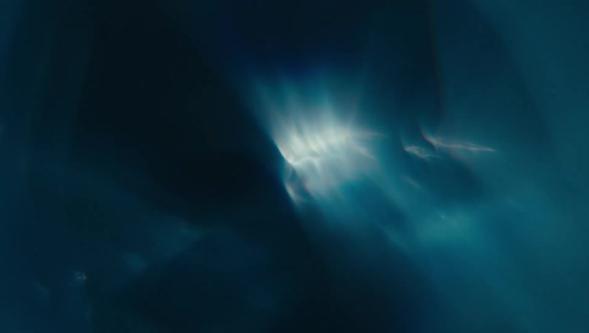 Extreme closeup of abstract water in fast motion with reflections
