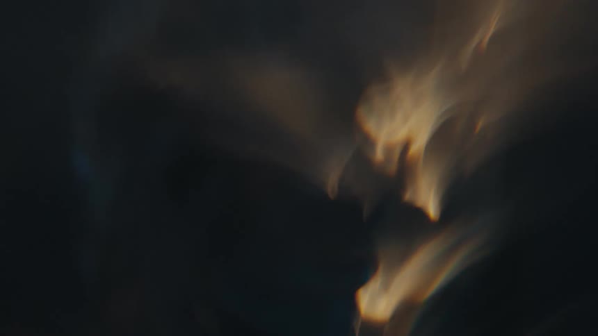 Extreme closeup of a spiral underwater with reflections