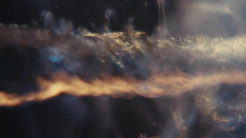 Close up of swirling clear water against a black background