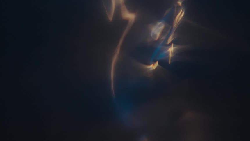 Light shines through a vortex in the water