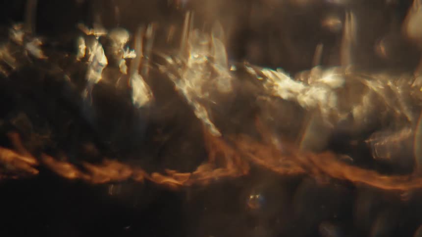 Extreme closeup of an underwater spiral in fast motion