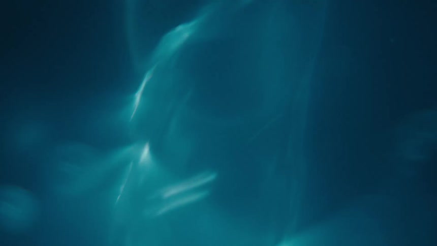 Close up of light shining through swirling clear water