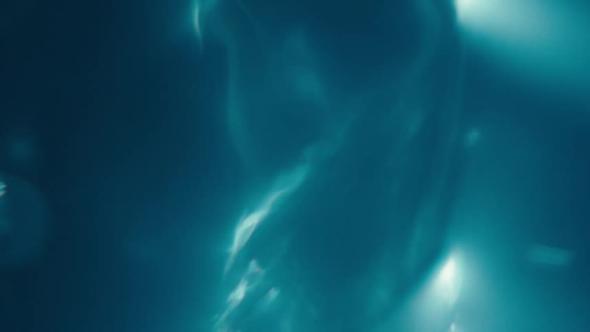 A tornado with blue lightning spinning underwater