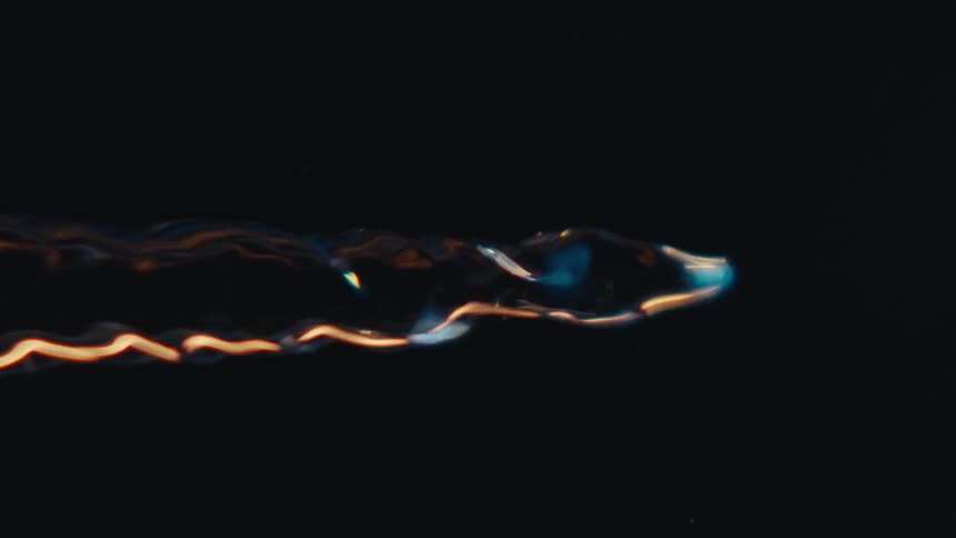 Close up of swirling clear water against a black background