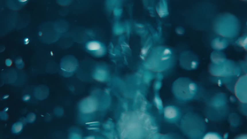 Water in a container spinning into a whirlpool