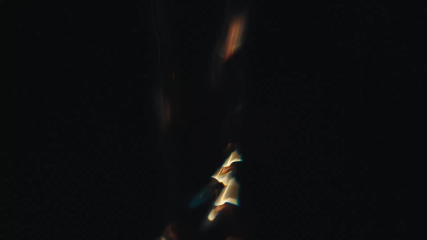 Fluid art of a water tornado glowing in the darkness
