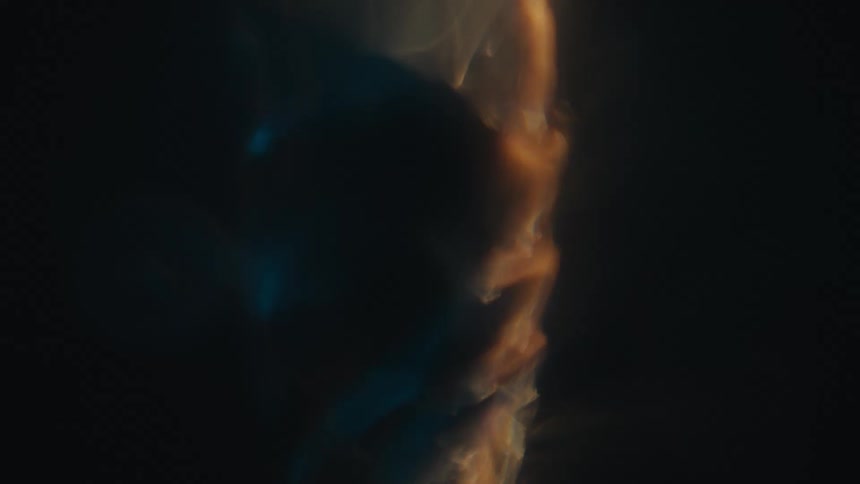 Water in fast motion spiraling with reflections of lights