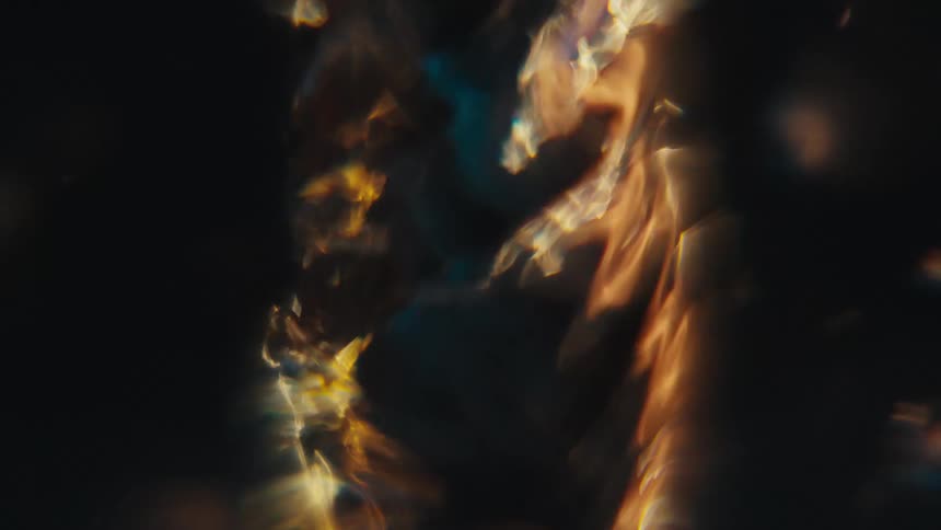 Extreme closeup of a rapidly moving and abstract spiral underwater