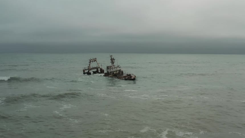 Aerial view of the wreck of a sunken ship near the coast