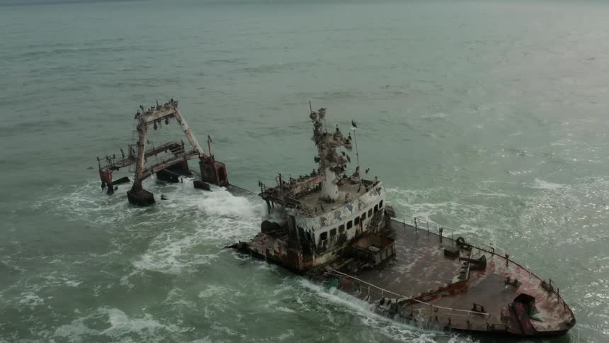 An old ship wrecked on a deserted beach
