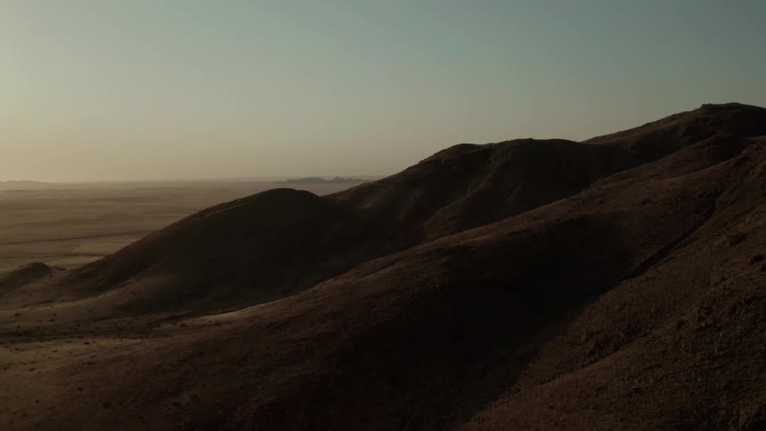 Aerial view of a barren mountain slope in the desert