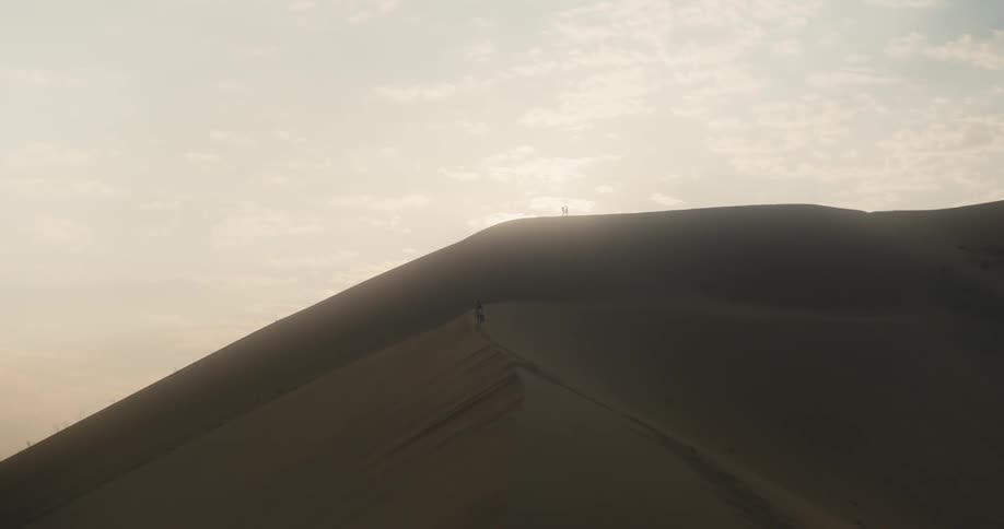 View of a dune in the desert with a morning sky