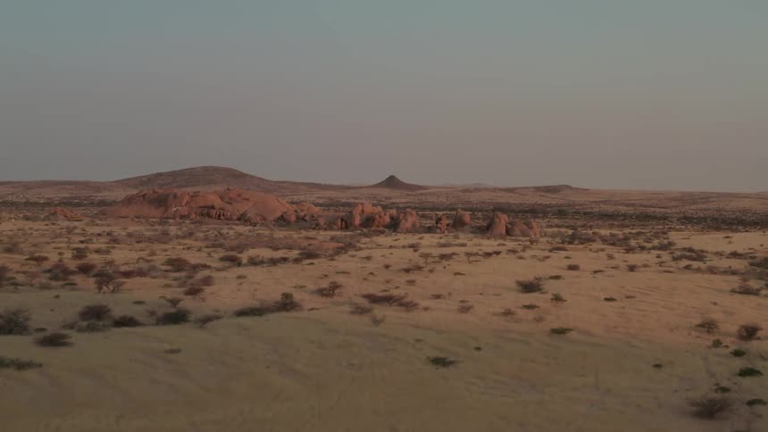 Aerial of a desert with red sand during the day