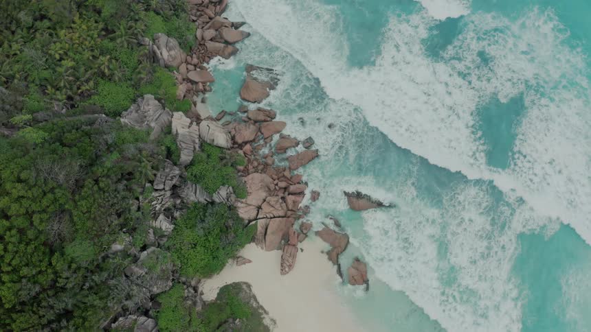 Aerial of a desert island with crystal clear waters