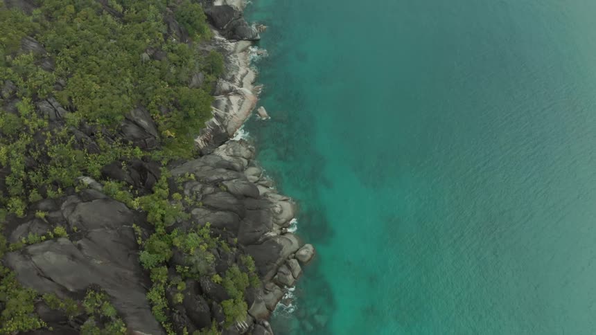 Aerial panorama of an island with turquoise blue sea