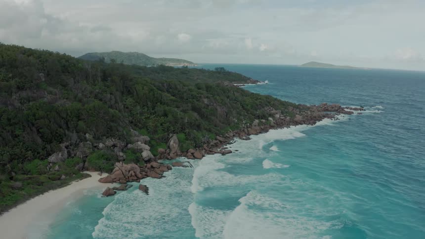 Aerial view of the coastline of an island next to the ocean