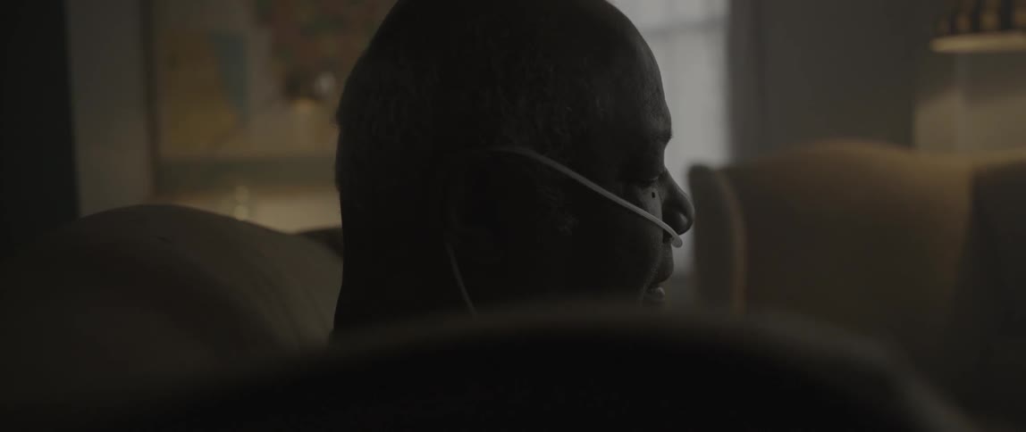 A man sits in his living room