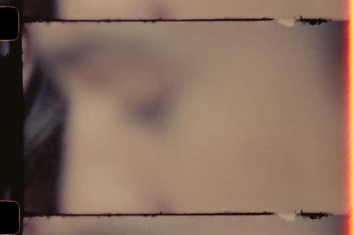 Close up of a young happy couple talking caught on vintage film