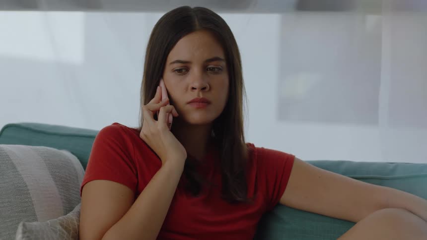 A woman is listening to her phone