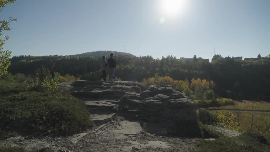 A family are hiking in the park