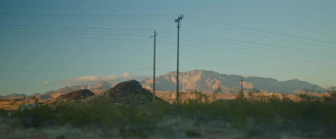 Panorama of a landscape with cliffs and a mountain range on the horizon in the morning