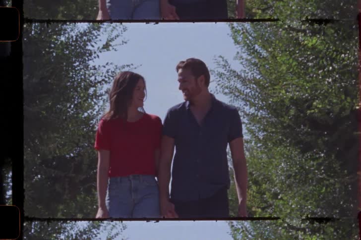 Couple walking hand in hand in a park