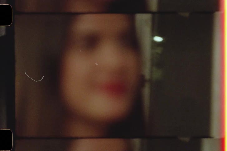 Young couple entering a house caught on vintage film