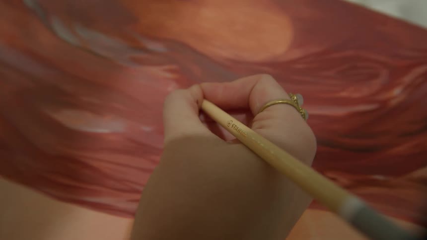 Pov person picks up colored pencil and sketches