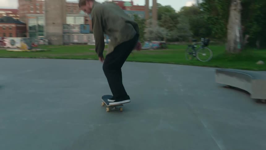 People are skateboarding at a park during spring