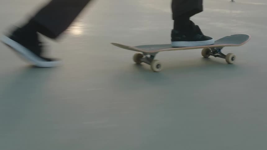 People are skateboarding at a park together