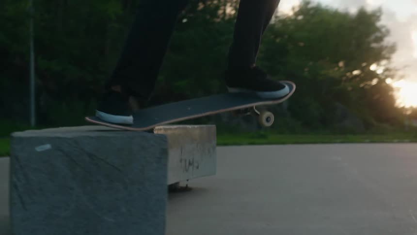 A person skateboarding and grinding
