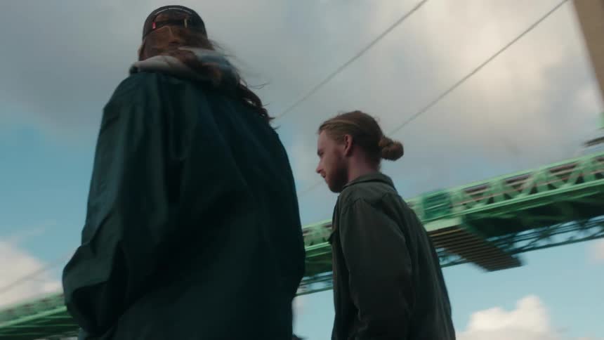 Two friends are talking to each other in the middle of the daytime