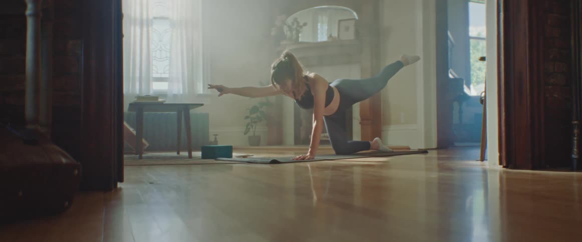 A woman does yoga at home