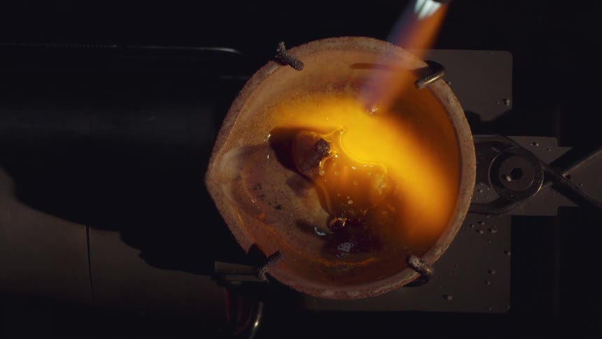 Powder being placed inside a bowl and melted with a blowtorch