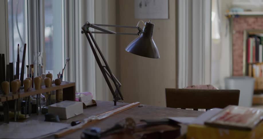 Internal view of a table with objects lamp indoors