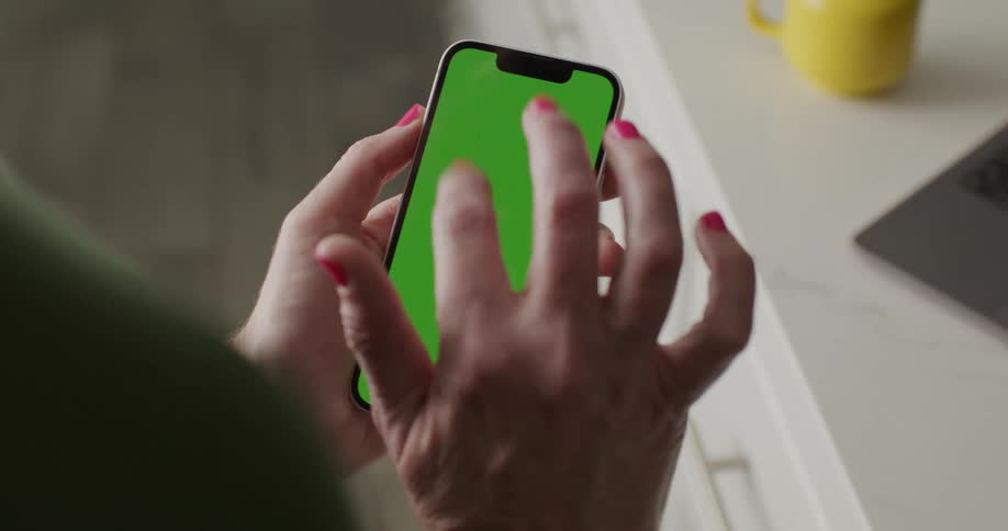 A woman touches the screen of her smart phone with her finger